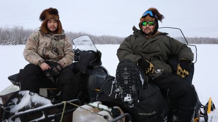 Gage and his brother Avery Hoffman on snowmobiles as they travel along the tundra. (BBC Studios Reality ProductionsIsaiah Branch - Boyle)