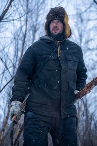 Chevie Roach builds a blind out of branches during the migratory water fowl season. (BBC Studios Reality Productions/Jayce Kolinski)