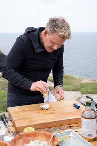Gordon Ramsay prepares an oyster at the final cook. (National Geographic/Justin Mandel)