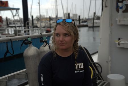 Scientist Erin Spencer on the docks at Riviera Beach. (National Geographic/Lisa Tanner)