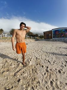 Caleb Swanepoel on Camps Bay Beach, Cape Town. (National Geographic/Robert Cowling)