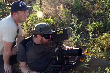Producer and Director Alex Minton and Cameraman James Salisbury film a monarch butterfly. (National Geographic for Disney/Sally Mclennan)