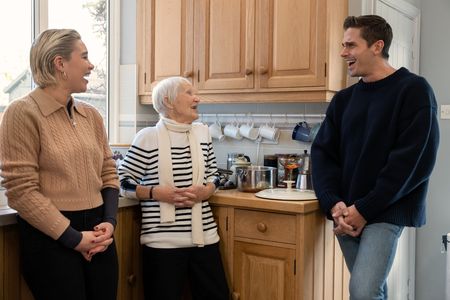 Florence Pugh, Granny Pat and Antoni Porowski laugh in the kitchen at Granny's house. (National Geographic/Chris Raphael)