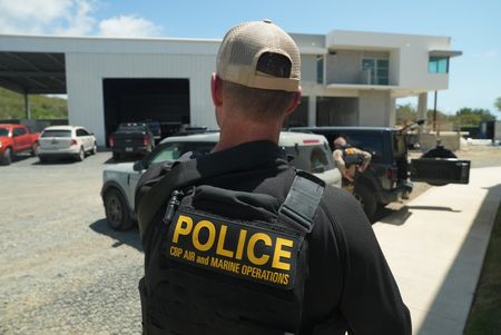 A CBP Agent walks towards a vehicle in St Thomas, USVI. (Lucky 8 TV/Paul Taggart)