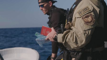 CBP AMO Agents Yadier and Squires check passports out on the open seas near Mayaguez, P.R. (Lucky 8 TV/Paul Taggart)