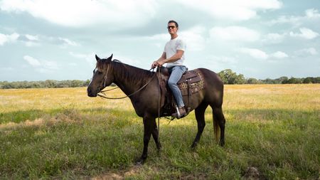 Antoni Porowski on horseback on Jim's ranch. (National Geographic/Rebecca Eishow)