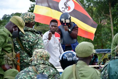Bobi Wine during an exchange with Uganda People's Defence Forces (UPDF) and Local Defence Unit (LDU) after they stopped his procession along Jinja road, Kampala as he headed for his campaigns on November 30, 2020.  (photo credit: Lookman Kampala)