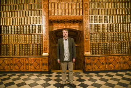 Tony Pollard in the library at Jasna Gora Monastery, Poland. In 1655 the monastery defended itself against an onslaught from the Swedish army. (National Geographic/Ciaran Henry)