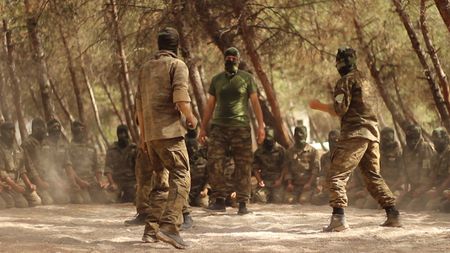 NORTHERN ALEPPO, SYRIA - Ahrar al-Sham a Syrian rebel group, trains outdoors in Northern Aleppo. (photo credit:  Junger Quested Films LLC/Turkey Prod Services Co)
