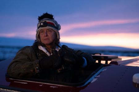 Sue Aikens is on the lookout for ptarmigan and rabbits as an opportunity to gather subsistence food during the winter season. (BBC Studios Reality Productions, LLC/Jayce Kolinski)