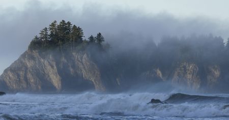 Fog envelopes an offshore rock on the Pacific Coast. (credit: National Geographic/Jesse Wippert)