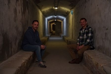 Arthur Williams and Silvia Villarnelll sat across from each other in tunnels underneath Almeria called the "Refugios" in Spain. (National Geographic/Ciaran Henry)