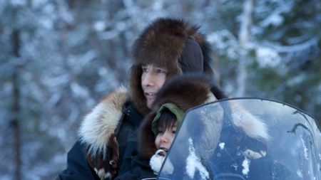 Ricko and Keenan DeWilde travel along their trapline and spot a moose in the distance. (BBC Studios/Ryan Walsh)