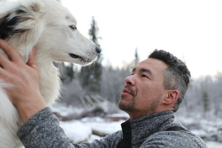 Joel Jacko with his dog, Tracker in the winter season. (National Geographic/Lauren "Bird" Dixon)