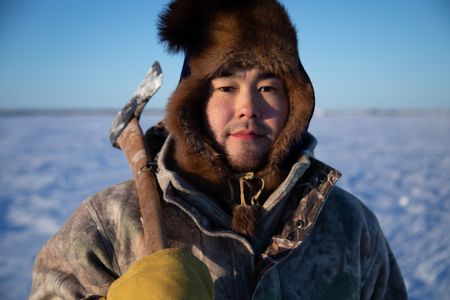 Gage Hoffman setting fish nets under the ice with his brother for subsistence food during the winter season. (BBC Studios Reality Productions, LLC/Isaiah Branch - Boyle)