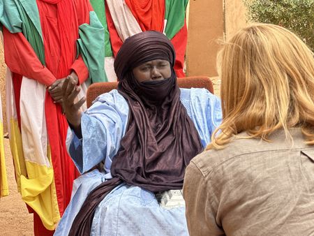 A local Tuareg leader speaks with Mariana van Zeller in Agadez, Niger. (National Geographic for Disney)