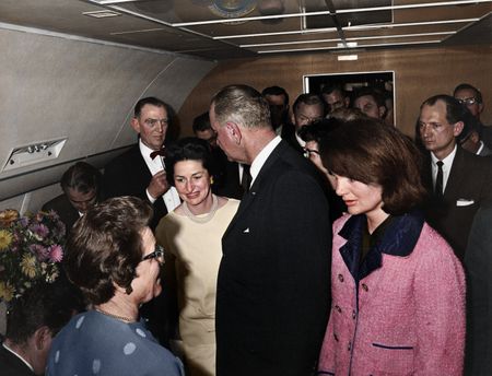This colorized archival image shows the swearing-in ceremony of Lyndon B. Johnson (LBJ) as President aboard Air Force One with former first lady Jacqueline Kennedy standing next to him, Nov. 22, 1963, in Dallas. (Cecil Stoughton/White House Photographs/John F. Kennedy Presidential Library and Museum, Boston)