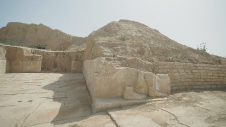 Recent excavations have uncovered a damaged wall carving outside a previously unknown chamber in Mosul, Iraq. (Windfall Films/Ali Hilal Ali Hussain)