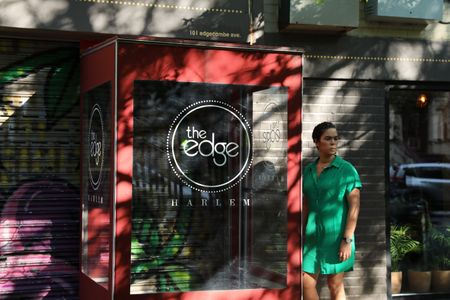 BLACK TRAVEL ACROSS AMERICA - Co-Owner, Juliet Masters opens her Caribbean-British fusion restaurant, the Edge, for another busy day. (National Geographic for Disney/Victoria Donfor)