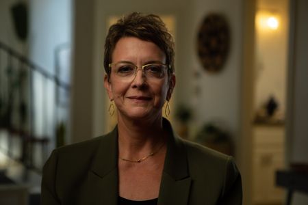 Amy Downs is pictured in close-up portrait during the production of National Geographic's Oklahoma City Bombing: One Day In America. Downs worked at the Credit Union Office in the Alfred P. Murrah Building and was rescued six hours after the bomb explosion. On April 19, 1995, America experienced the deadliest domestic terror attack in its history. Thirty years later, this series tells the story of that day told only by those who lived through it ñ the people of Oklahoma.  (National Geographic/Brandon Widener)