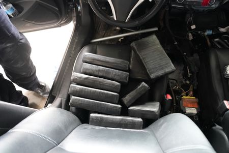 Multiple packages of suspected narcotics are pictured on the driver's seat of a suspect's vehicle after they were found smuggled inside in Brownsville, Texas. (National Geographic)