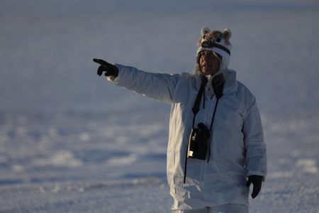 Sue Aikens hunts during the winter season, camouflaging with the winter arctic terrain. (BBC Studios Reality Productions, LLC/Lauren 'Bird' Dixon)