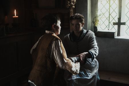 The young boy hands Margaret Spear a book. (Dash Productions Services LTD/Antoan Ivanov)