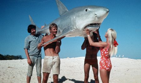 Valerie, Ron and others holding model shark. (photo credit: Ron & Valerie Taylor)