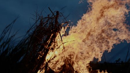 Large pile of wood on fire. (Dash Productions Services LTD/Samuel Purcell, Oliver Watts)