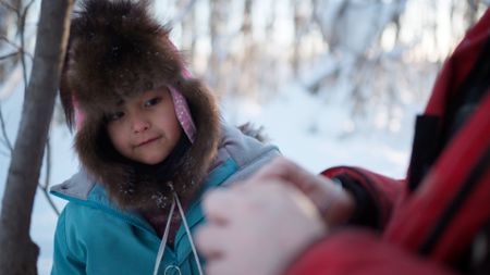 Ricko DeWilde shows his daughter Maya how to set rabbit snares. (BBC Studios/Ryan Walsh)