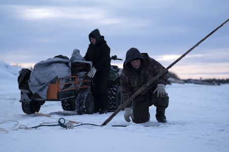 Chip Hailstone, and his daughter, Tinmiaq Hailstone set fish nets under the ice. (BBC Studios Reality Productions, LLC/Dwayne Fowler)