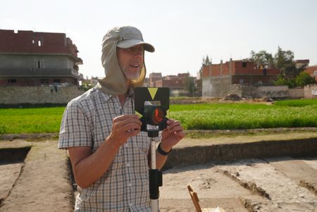 Henning Franzmeier uses a measurement device at the Pi Ramesses site in Egypt. (Windfall Films)