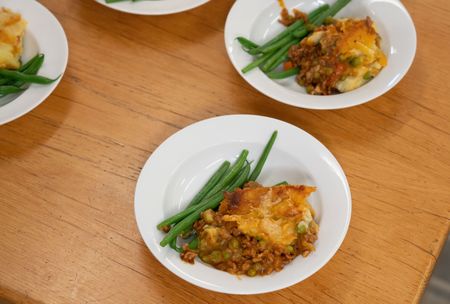 Shepherd's Pie plated with green beans. (National Geographic/Chris Raphael)