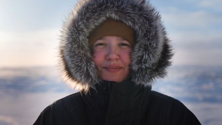 Nalu Apassingok getting ready to head out with her brother on a caribou hunt. (National Geographic)
