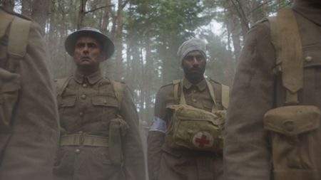 Captain Anis Khan (played by Shammi Aulakh) and Medic Siddiq Ahmed (played by Rishi Rian) walk through forest after they were taken prisoners by the Germans in a WW2 historic reenactment scene for "Erased: WW2's Heroes of Color." Captain Anis Khan and Medic Siddiq Ahmed were members of Force K6, an Indian Regiment of mule handlers in WW2. Amidst the chaos of Dunkirk and the advancing German Army, one little known Indian Regiment fights for victory and independence. (National Geographic)