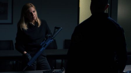 Mariana holds a ghost gun confiscated from an earlier police raid with Detective Swetavage. (National Geographic)