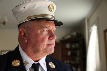 9/11: ONE DAY IN AMERICA - Jay Jonas, FDNY Captain Ladder Six, led his men through the stairs of the North Tower when the building collapsed on them. (National Geographic/Daniel Bogado)