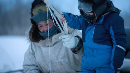 Agnes Hailstone and her grandson, Sabastian Hailstone fish for pike through the ice. (BBC Studios/Pedro Delbrey)