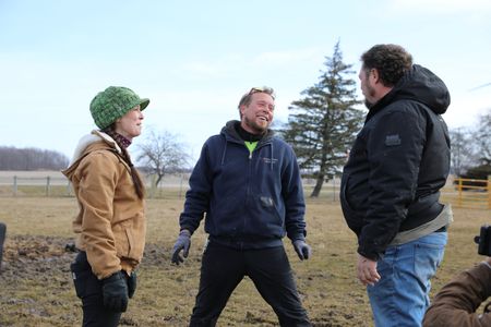 Beth Pol, Ben Reinhold, and Charles Pol meet by the Pol family's animal pasture to discuss their plan to gather the pregnant Merino sheep. (National Geographic)