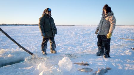 Gage and Avery Hoffman successfully collect fish from their nets. (BBC Studios/Danny Day)