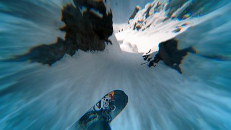 Travis Rice point of view with special effects as he prepares to squeeze through two rocks with his snowboard on an Alaskan mountain.  (photo credit: Travis Rice, Inc)