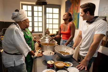 Marie Caroline, Abi Diedhiou, Issa Rae and Antoni Porowski prepare the ceere mboum, a traditional Senegalese dish. (National Geographic/John Wendle)