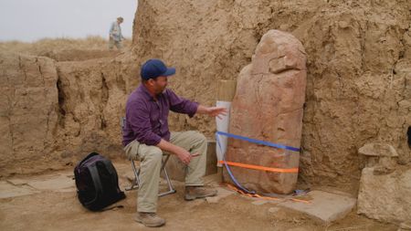 Archaeologist Michael Danti observes an ancient stele in Limmu, Iraq. (Windfall Films)