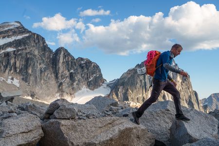 Tommy Caldwell jumping across rocks in the mountains of Bugaboo Provincial Park.  (National Geographic/Taylor Shaffer)