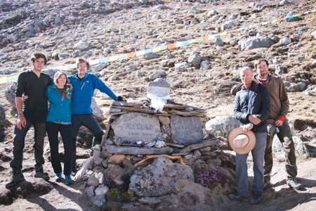 Lowe-Anker family at the burial service for Alex Lowe and David Bridges on June 27, 2016 at Shishipangma Basecamp. (National Geographic/Max Lowe).