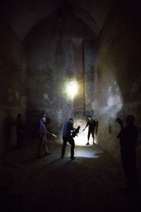 Acre, Israel - Director Mike Slee and DOP Pete Allibone film Dr. Albert Lin entering an underground crusader-era construction. (Blakeway Productions/National Geographic)