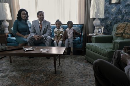 The King family sits for an interview in their home in GENIUS: MLK/X. (From left: Weruche Opia as Coretta Scott King, Kelvin Harrison Jr. as Martin Luther King Jr., Emelia Kahiha as Yoki King, and Carter Ace Oliver as Martin Luther King III). (National Geographic/Richard DuCree)