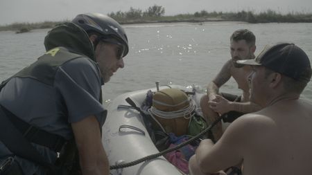 The Civil Guard stops two fishermen who do not have the proper documentation in Tarragona, Spain. (National Geographic)