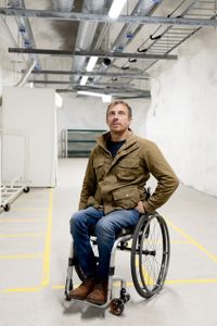 Arthur Williams looks at provisions in the Merihaka civil defense shelter, a nuclear bunker in Helsinki's city center that can accommodate 6,000 people in emergency. (National Geographic/Ciaran Henry)