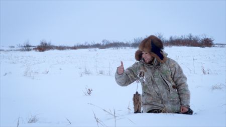 Gage Hoffman sets lures for prime fur animals to hunt with is brother, Avery. (BBC Studios/Danny Day)